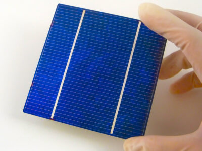 Gloved hand holding a Solar Cell