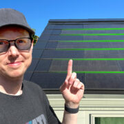 Matt Ferrell pointing at a Tesla Solar roof