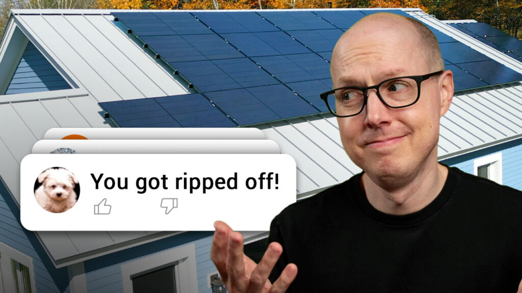 Matt Ferrell in front of his Solar roof looking at a comment that says "You got ripped off!"