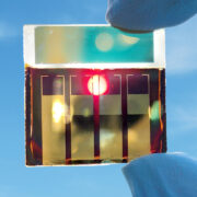 A perovskite solar cell held up to the sun