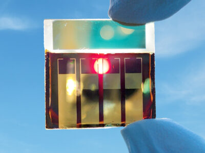 A perovskite solar cell held up to the sun